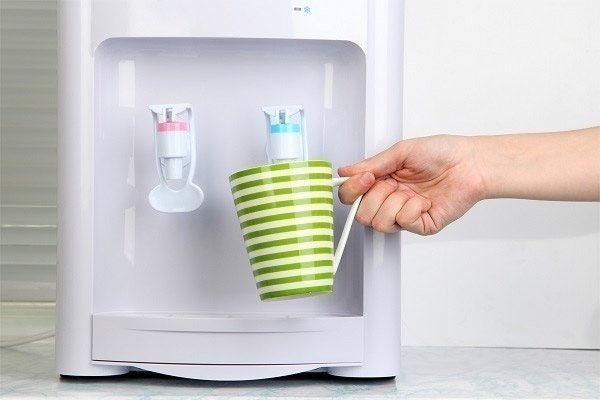 Filling cup at water cooler